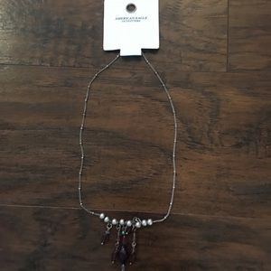 Silver necklace with purple beads. American Eagle